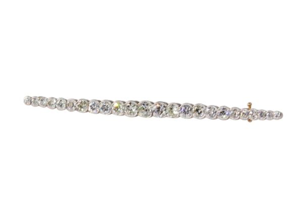 Gold and platinum bar brooch with old cut diamonds.