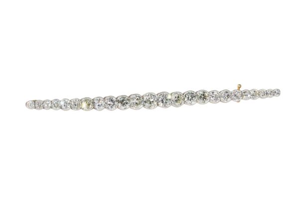 Gold and platinum bar brooch with old cut diamonds.