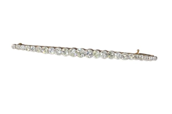 Gold and platinum bar brooch with old cut diamonds.