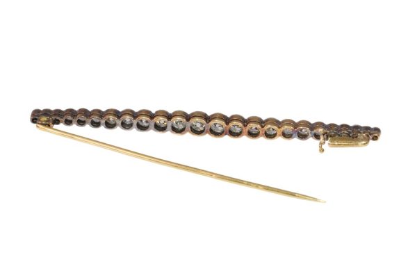 Gold and platinum bar brooch with old cut diamonds.