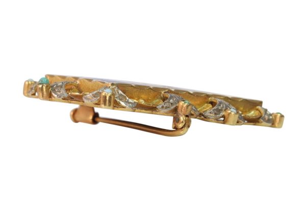 Vintage enamel brooch in yellow and white gold.