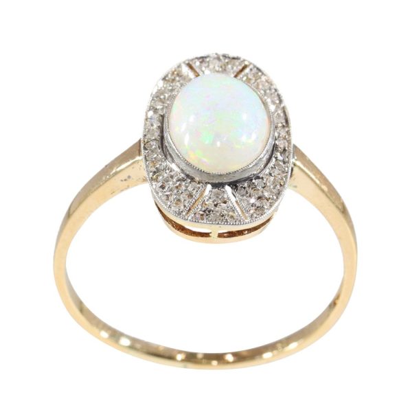 Antique opal and diamond ring in platinum and gold.