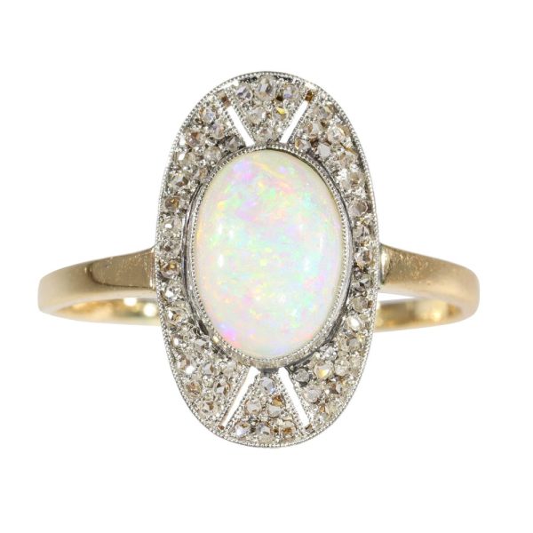 Antique opal and diamond ring in platinum and gold.