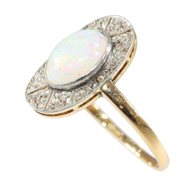Antique opal and diamond ring in platinum and gold.
