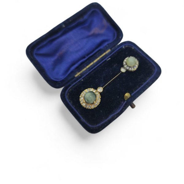 Antique Diamond and Cats Eye Chrysoberyl Pin Brooch, decorated with a cat's eye chrysoberyl and diamond cluster to each end. Presented in fitted box.