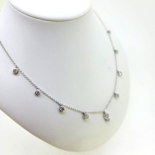 Diamond Set Pendant Chain Necklace, 1.51 carats, 18ct white gold chain necklace showcasing nine individual bezel set pendants, spaced equally to the front