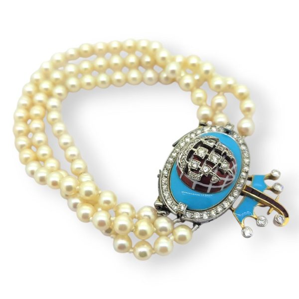 Akoya Pearl Bracelet with Blue Enamel Ruby and Diamond Clasp, Three rows of Akoya pearls to blue enamel clasp with diamond set sailing vessel and crown with letter 'F' in rubies