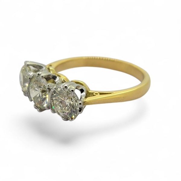 2.20ct Diamond Three Stone Trilogy Engagement Ring in Yellow Gold, 0.80ct diamond flanked by 68.5ct and 71.5ct diamonds in platinum to 18ct yellow gold band