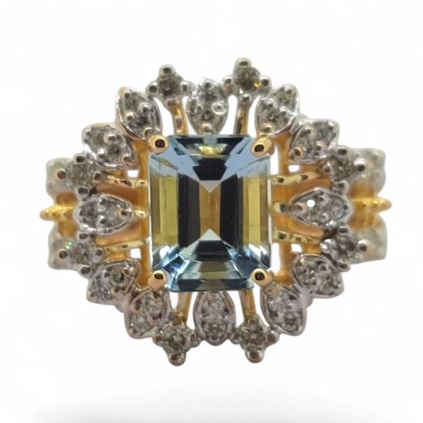 Aquamarine and diamond cluster dress ring in 21 carat yellow gold