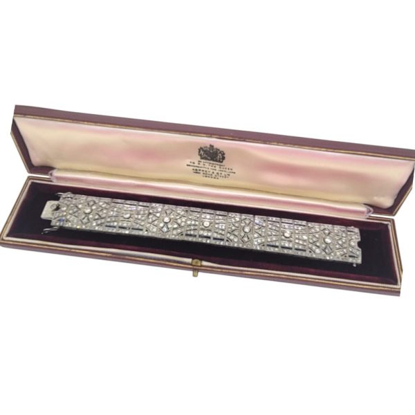Art Deco Sapphire and Diamond Bracelet in Platinum, wide platinum bracelet set with sparkling diamonds accented with rich blue sapphires Circa 1920s 1930s