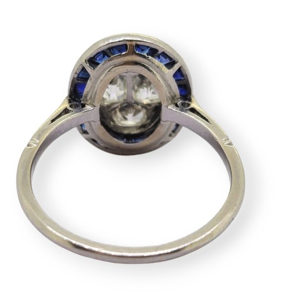 Vintage Sapphire and Diamond Oval Target Cluster Engagement Ring in Platinum, oval cluster of old-cut diamonds with outer border of calibre sapphires