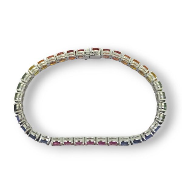 Multi Fancy Colour Rainbow Sapphire Line Bracelet, 16.10 carats of oval-cut pink sapphires, blue sapphires, green sapphire, yellow sapphires and orange sapphires in 18ct white gold