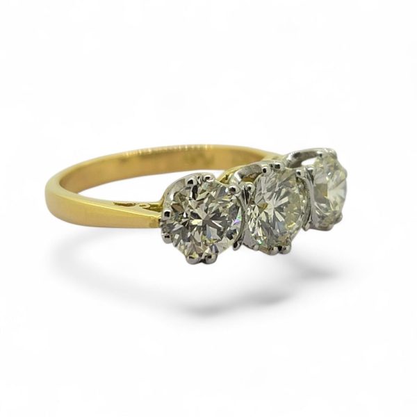 2.20ct Diamond Three Stone Trilogy Engagement Ring in Yellow Gold, 0.80ct diamond flanked by 68.5ct and 71.5ct diamonds in platinum to 18ct yellow gold band