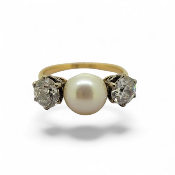 Old Cut Diamond and Pearl Three Stone Engagement Ring, central pearl flanked by 1ct old-cut diamonds in 18ct yellow gold