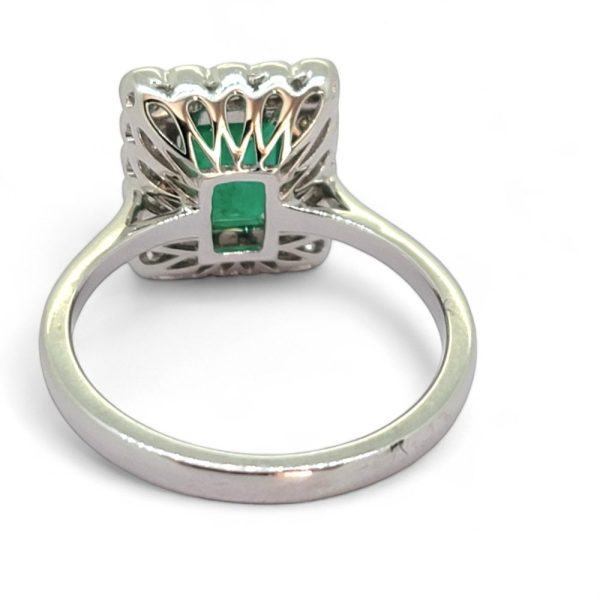 2ct Emerald and Diamond Cluster Engagement Ring, 2.12ct emerald-cut emerald surrounded by rectangular border of sparkling diamonds in 18ct white gold