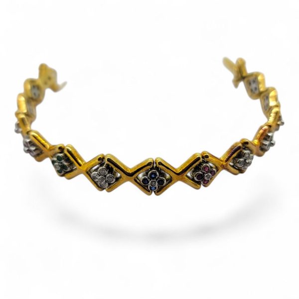 Ruby Emerald Sapphire Diamond Set Gold Bracelet, 18ct yellow gold 'X' design link bracelet accented with clusters of rubies, emerald, sapphires and diamonds