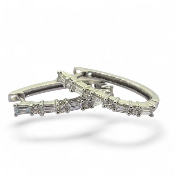 Horseshoe 1.31ct Brilliant and Baguette Diamond Hoop Earrings, 1.31 carats of alternating baguette and round brilliant diamond set horseshoe-shaped hoop earrings in 18ct white gold
