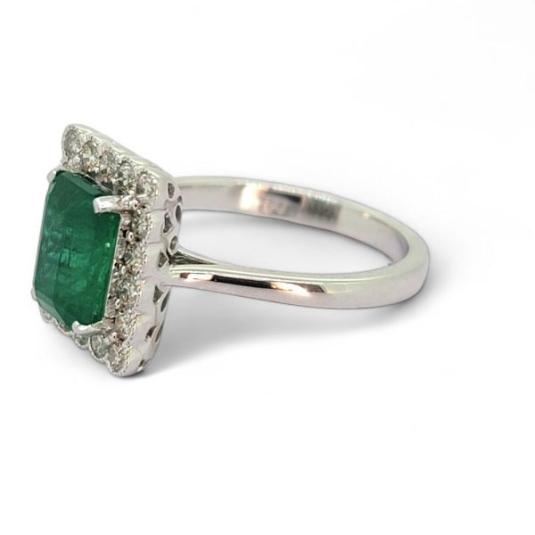 2ct Emerald and Diamond Cluster Engagement Ring, 2.12ct emerald-cut emerald surrounded by rectangular border of sparkling diamonds in 18ct white gold