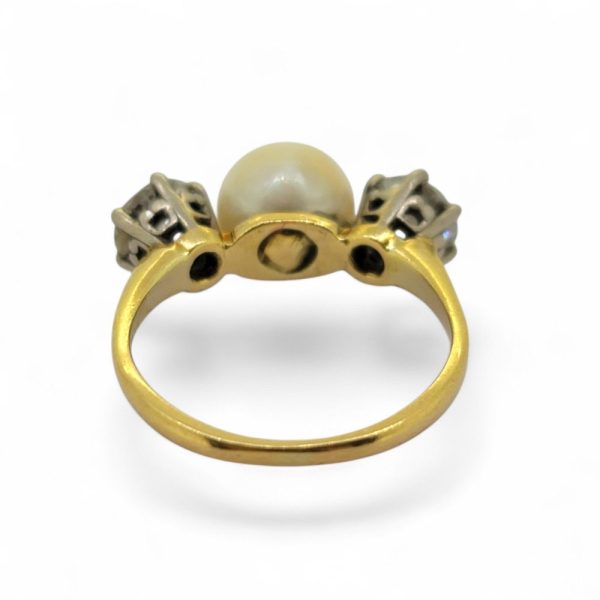 Old Cut Diamond and Pearl Three Stone Engagement Ring, central pearl flanked by 1ct old-cut diamonds in 18ct yellow gold