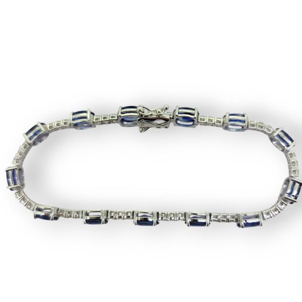 13.8ct Oval Sapphire and Diamond Line Bracelet, comprising 13 oval sapphires and 39 round diamonds in 18ct white gold
