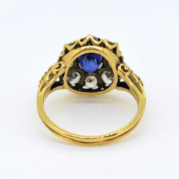 Antique Style 1.70ct Sapphire and Diamond Cluster Engagement Ring, 1.50ct oval cut sapphire surrounded by 1.40cts diamonds in crown cluster setting in 18ct yellow gold