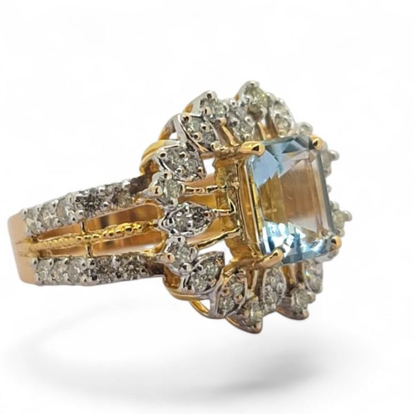 Aquamarine and diamond cluster dress ring in 21 carat yellow gold