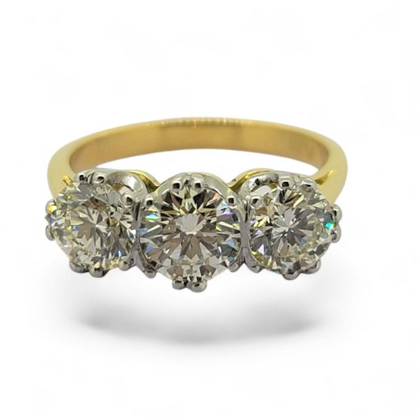 2.20ct Diamond Three Stone Trilogy Engagement Ring in Yellow Gold, 0.80ct diamond flanked by 68.5ct and 71.5ct diamonds in platinum to 18ct yellow gold band