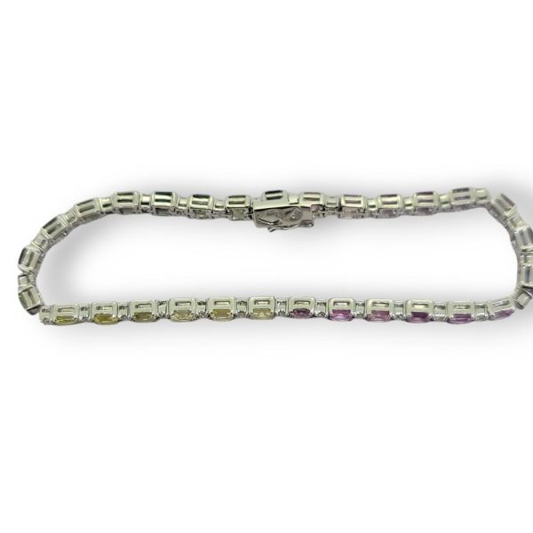 Rainbow Sapphire and Diamond Line Bracelet, 8.27 carats multi fancy colour pink, purple, green, yellow and blue sapphires with diamond accents in 14ct white gold
