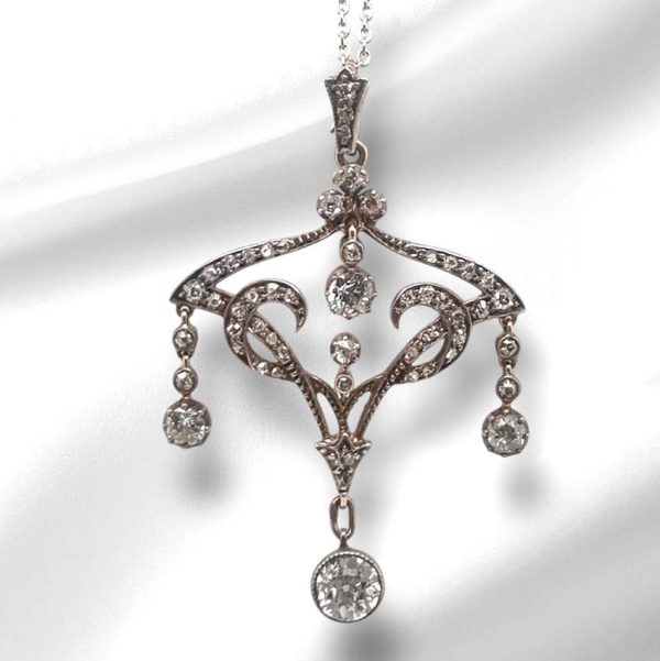 Antique Art Nouveau 1.50ct Old Cut Diamond Pendant, iconic fluid design set with 1.50 carats of old-cut diamonds with articulated drops in silver to 18ct gold