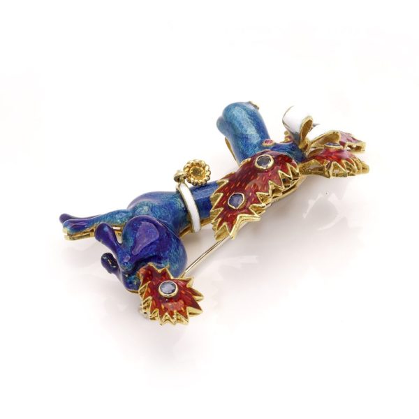 Whimsical poodle enamel brooch in gold with sapphires and rubies.