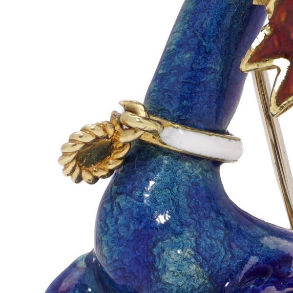 Whimsical poodle enamel brooch in gold with sapphires and rubies.