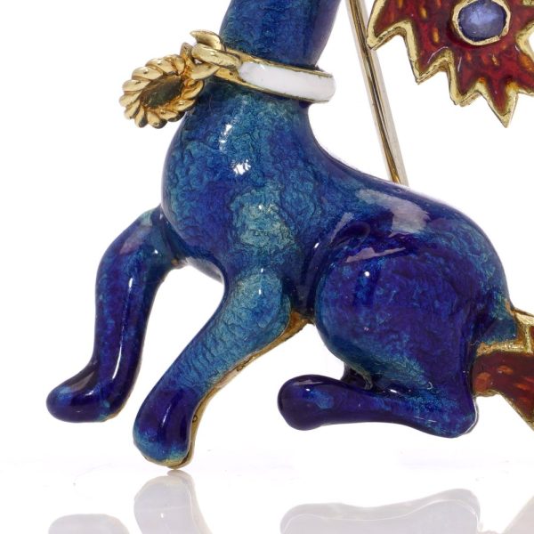 Whimsical poodle enamel brooch in gold with sapphires and rubies.