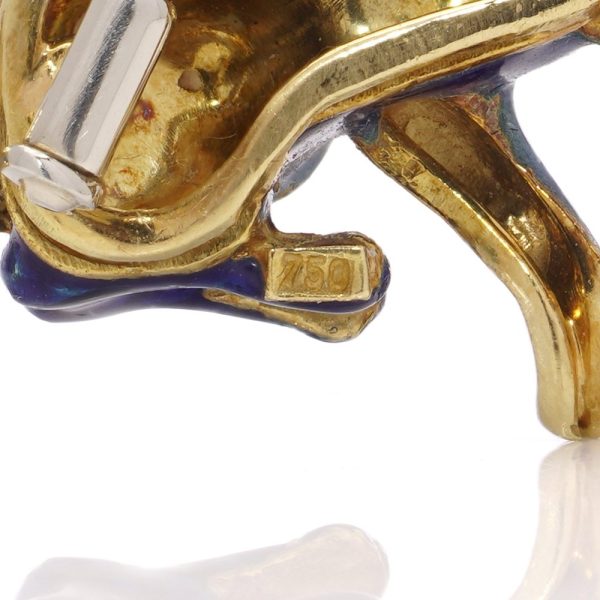 Whimsical poodle enamel brooch in gold with sapphires and rubies.