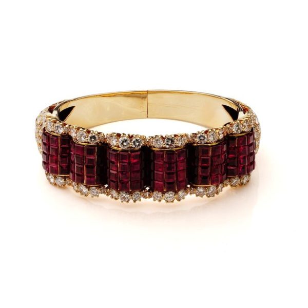 Ruby and diamond bangle in 14 carat gold.