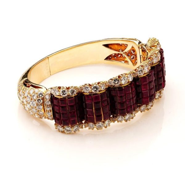 Ruby and diamond bangle in 14 carat gold.