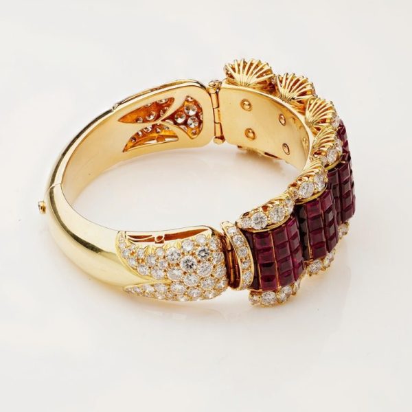 Ruby and diamond bangle in 14 carat gold.