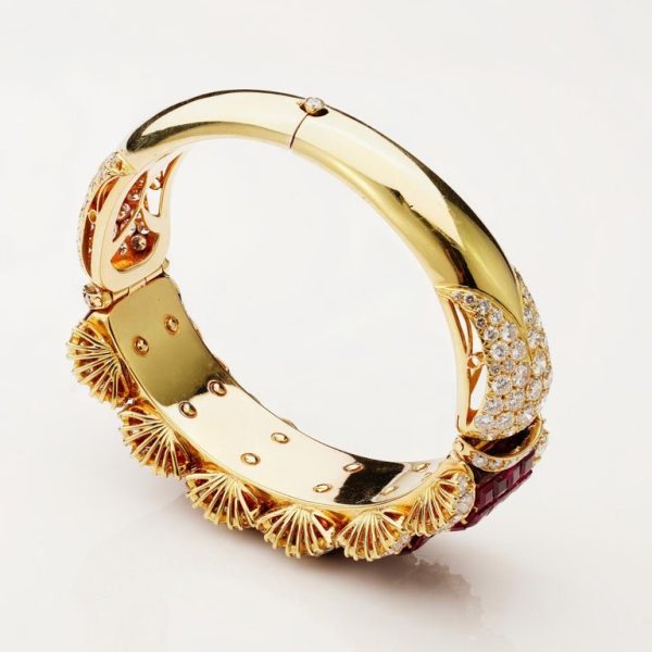 Ruby and diamond bangle in 14 carat gold.