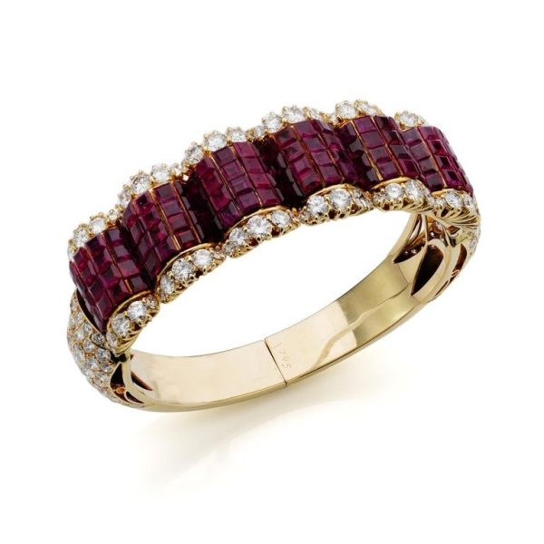 Ruby and diamond bangle in 14 carat gold.