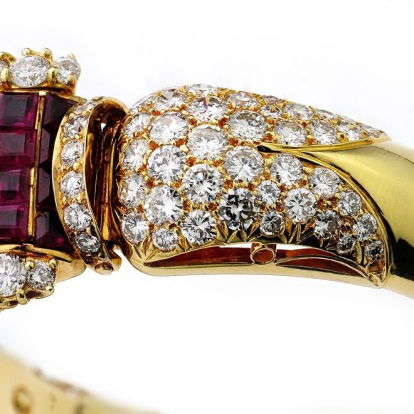 Ruby and diamond bangle in 14 carat gold.