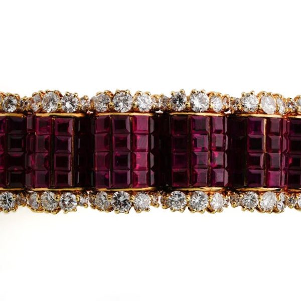 Ruby and diamond bangle in 14 carat gold.