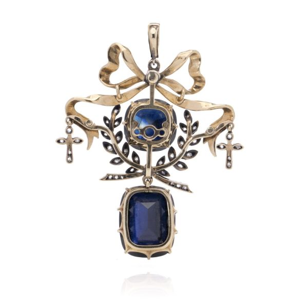 Antique diamond and sapphire pendant in gold and silver.