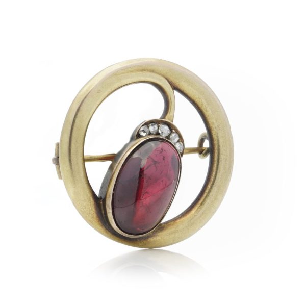 Amethyst and diamond brooch in gold.