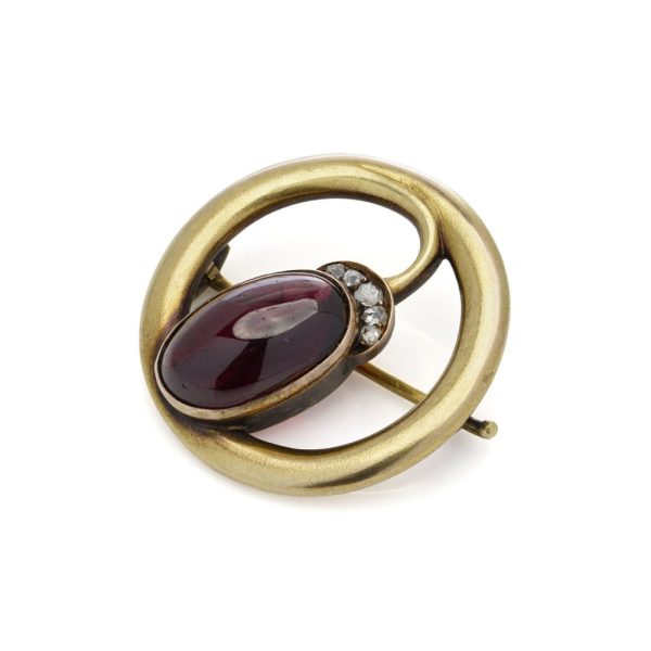 Amethyst and diamond brooch in gold.