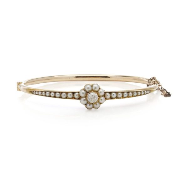 Victorian gold bangle with pearls and old cut diamond.