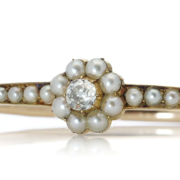 Victorian gold bangle with pearls and old cut diamond.