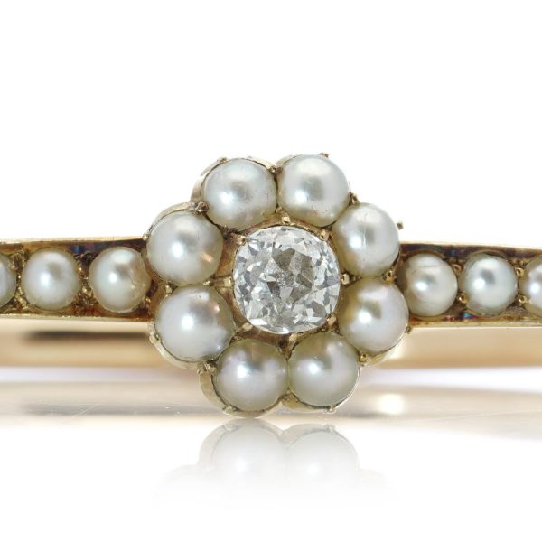 Victorian gold bangle with pearls and old cut diamond.