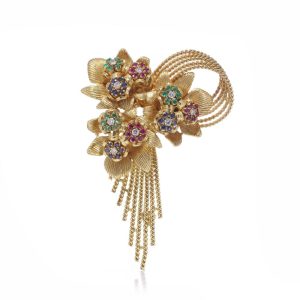 Diamond and gemstone brooch in gold.