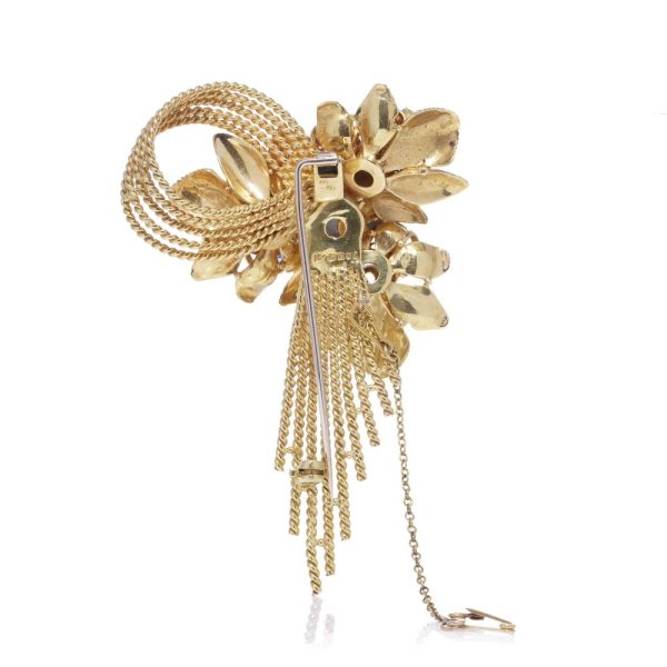 Diamond and gemstone brooch in gold.