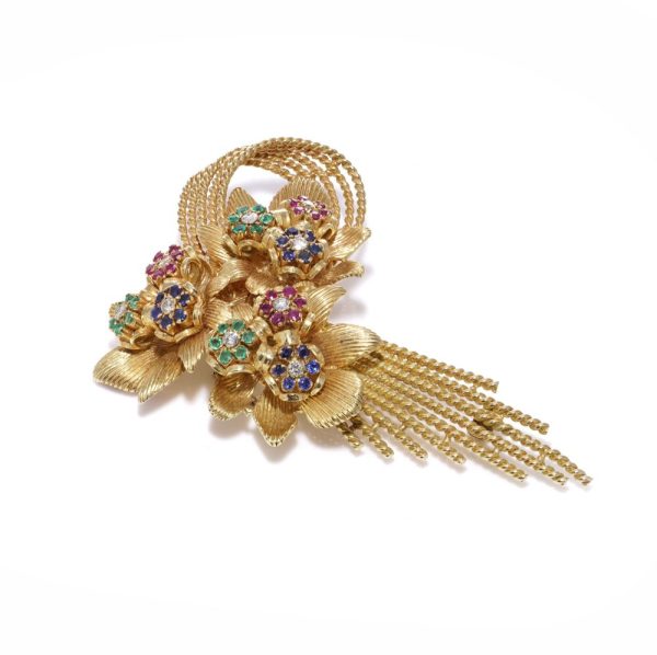 Diamond and gemstone brooch in gold.