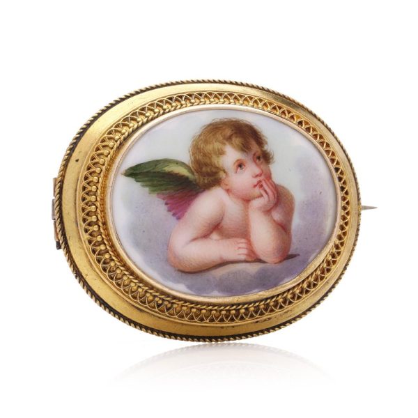 Victorian enamel cherub brooch in gold.